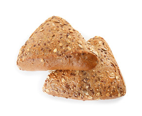 Triangle buns with seeds isolated on white. Wholegrain bread