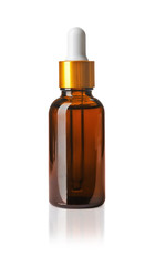 Cosmetic bottle and pipette with essential oil on white background