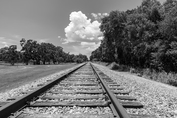 Black and white of a train track leading away
