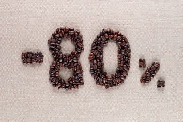 80% discount from coffee beans aligned in center, shot close up