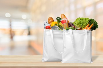 Bags with bread and variety vegetables on