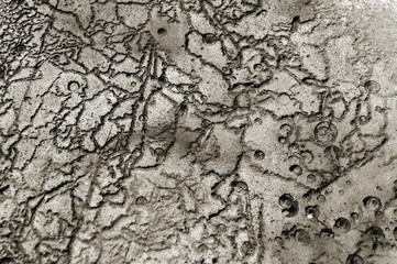 Texture abstract closeup background concrete surface with grooves, furrows, and bubbles