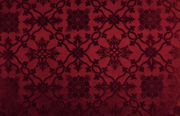 Obraz na płótnie Canvas Deep red burgundy material with raised textured pattern