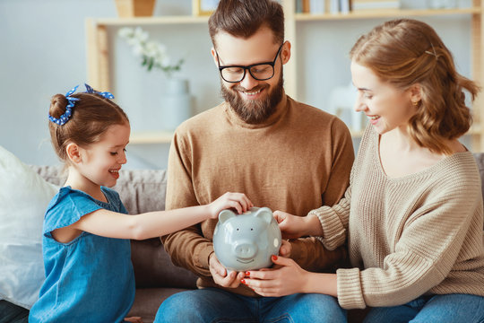 family savings, budget planning, children's pocket money. family with piggy Bank  .