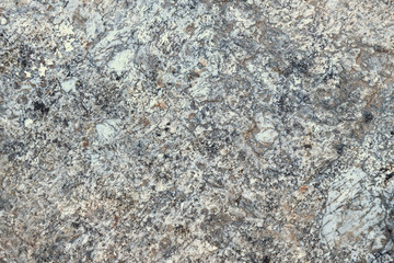 Natural granite texture closeup for background.