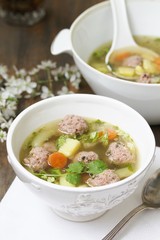 Italian Wedding Meatball Soup. soup in a beautiful white bowl