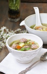 Italian Wedding Meatball Soup. soup in a beautiful white bowl
