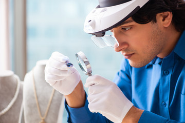 Young jeweler working in his workshop