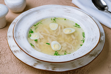 Chicken soup bouillon in a plate
