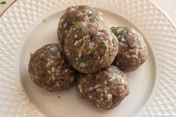 Meat meatballs on a plate. Meat meatballs on a white plate. Meat balls on a white background