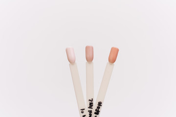 Tips for pastel nail polishes. Palette examples of different colors for nails on a white background.
