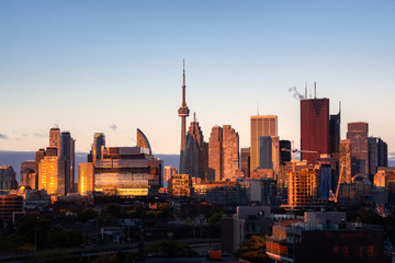 Fototapeta na wymiar Toronto city center skyline during early morning golden hour sunrise