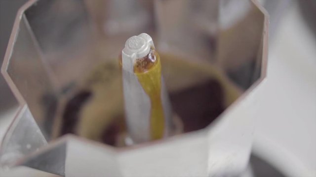 hot black coffee in slow motion coffee percolator steam