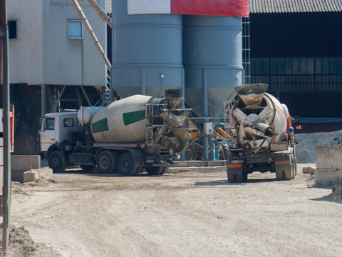 Two large cement truck trucks brought cement to the industrial area of the plant in special containers.