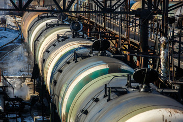 Railway trains with tanks for the transport of petroleum products are on the siding