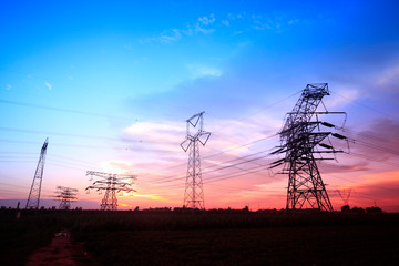 Naklejka premium In the evening, the silhouette of high voltage towers
