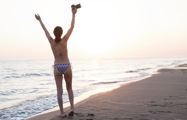 Obraz na płótnie Canvas beautiful woman swim wear at the beach in sunny summer