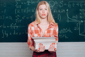 Sexy female student ready to write exam testing. Blonde sexy woman in front of chalkboard. Ready...