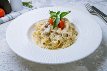 fettuccine with porcini mushrooms on white plate
