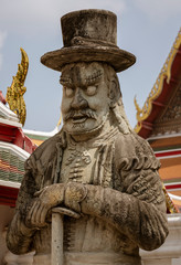 Fototapeta premium Chinese Warrior Guardian Statue At the Wat Pho Temple in Bangkok, Thailand