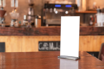 Menu frame standing on wood table in coffee shop. space for text marketing promotion