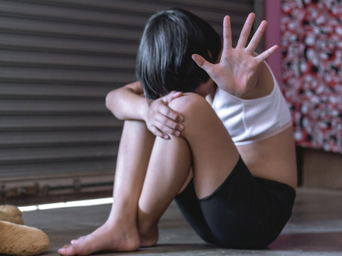 Stop violence and rape. concept photo of sexual assault,traumatized young girl