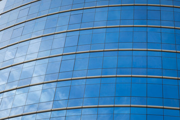 Fototapeta na wymiar Glass windows of modern office building