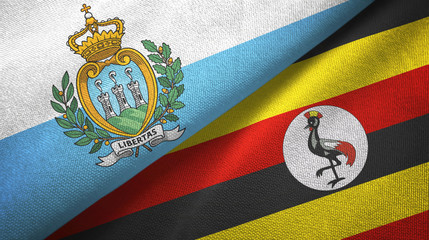 Fototapeta premium San Marino and Uganda two flags textile cloth, fabric texture