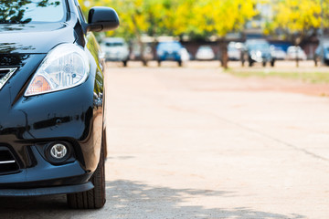 Half front view of black car park on the car park