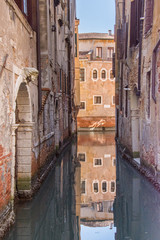 Narrow canals are famous and typical in Venice,Italy, 2019