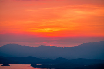 Fototapeta premium The natural background of the beautiful twilight sky, the surrounding atmosphere (trees, rivers, mountains) is a beautiful view of the journey, the view point. 