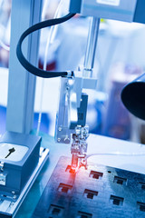 automatic soldering iron tips of robotic system for printed and assembly electric circuit board ( PCB ) at factory