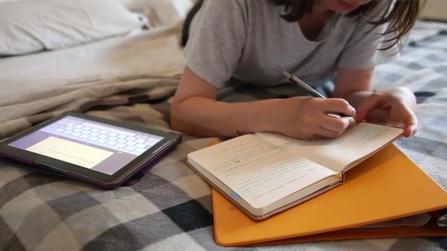 Stock video  College student doing the homework. Long study day for final exams.