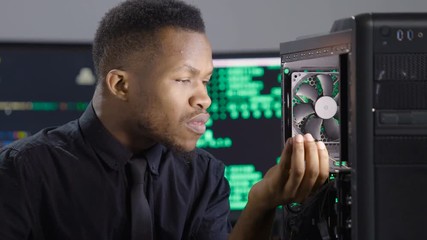 Computer technician repairing computer/server