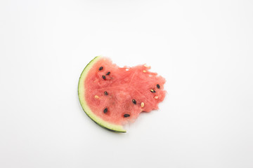 A slice of multiseeded watermelon, irregularly shaped fresh red watermelon