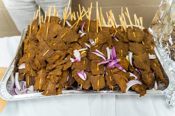 Nigerian pepperbeef suya on stakes at party