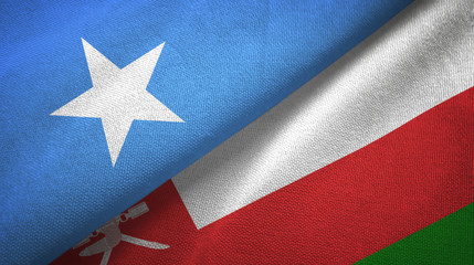 Fototapeta premium Somalia and Oman two flags textile cloth, fabric texture