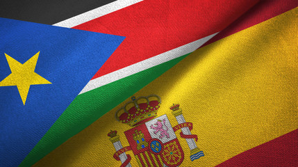 South Sudan and Spain two flags textile cloth, fabric texture