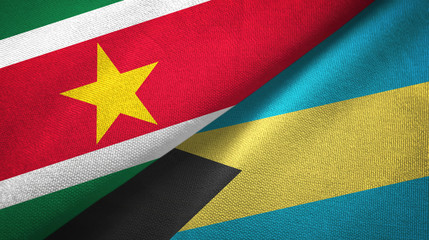 Fototapeta premium Suriname and Bahamas two flags textile cloth, fabric texture 
