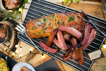Classic Caesar Salad with vegetable cheese bread mix on bowl, American Style BBQ grill on natural charcoal to make good smell