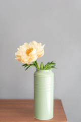 Yellow pion in a metal vase. Beautiful peony flower for catalog or online store. Floral shop concept . Beautiful fresh cut bouquet. Flowers delivery