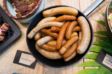 Mix Smoke grilled sausage pork chicken in oil pan, American Style BBQ grill on natural charcoal to make good smell