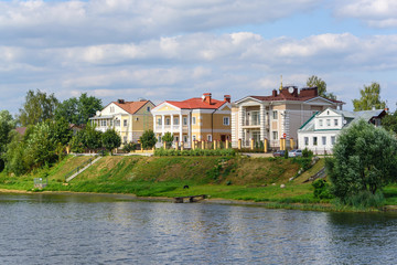 Fototapeta na wymiar Russia, Tver region, August 2018. Beautiful house on the river bank in the summer.