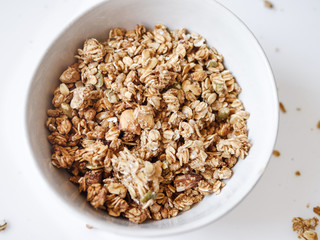 Cereal con flake whole grains in white bowl.