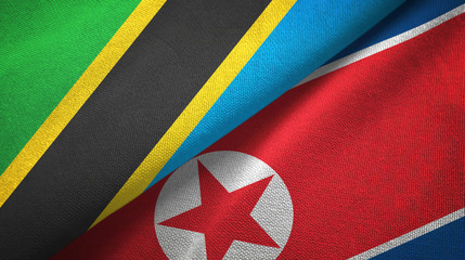Fototapeta premium Tanzania and North Korea two flags textile cloth, fabric texture