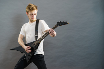 Man playing on electric guitar