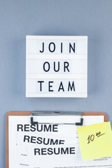 Join our team flat lay on blue background