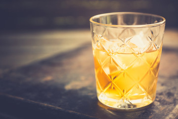 Old fahioned cocktail on the rustic background. Selective focus. Shallow depth of field.