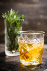 Old fahioned cocktail on the rustic background. Selective focus. Shallow depth of field.