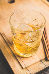 Old fahioned cocktail on the rustic background. Selective focus. Shallow depth of field.